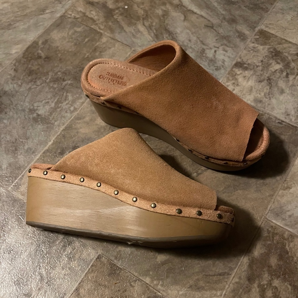 Peep toe clogs that are lightly worn.